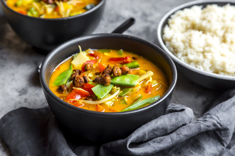 Red curry in bowls, rice stock photo