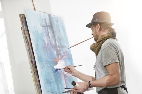 A close-up of easel for painting that stands in the studio concept of the  love of fine art Stock Photo by guyswhoshoot