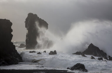 Ocean waves crashing against rock formations, Londrangar, Snaefellsnes, Iceland - CAIF07549