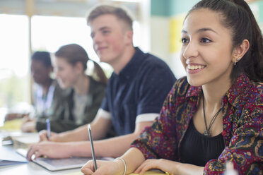 Students in classroom smiling during lesson - CAIF07699