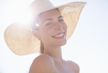 Woman wearing sun hat outdoors - CAIF07812