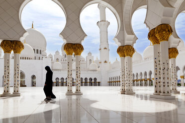 Woman walking at Sheikh Zayed Mosque - CAVF01536