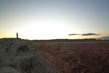 View of man standing on mountain against clear sky - CAVF01770