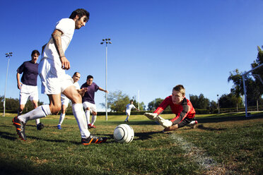 Soccer player scoring a goal at field - CAVF01905