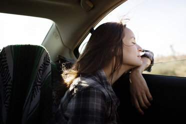 Happy woman traveling in car - CAVF02745