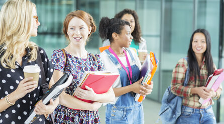 University students walking with books - CAIF08202