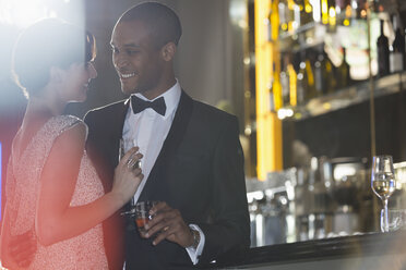 Well dressed couple at luxury bar - CAIF08378