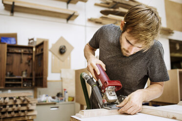 Craftsperson working in carpentry workshop - CAVF03281