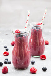 Two glass bottles of berry smoothie - LVF06770