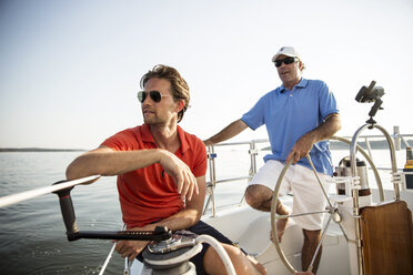 Friends looking away while traveling in yacht - CAVF03933