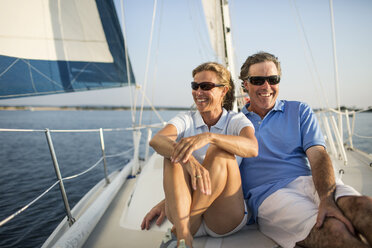 Smiling couple traveling in yacht - CAVF03941