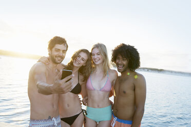 Group of friends enjoying beach party stock photo