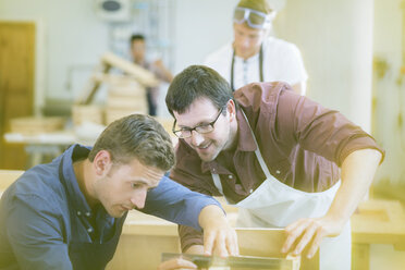 Carpenters working in workshop - CAIF08833
