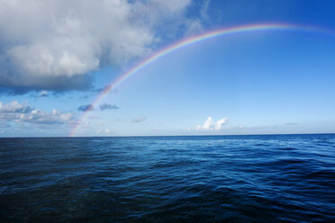 Idyllic view of rainbow over sea - CAVF04292