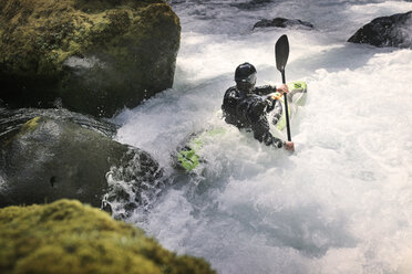 High angle view of man kayaking in river - CAVF04343