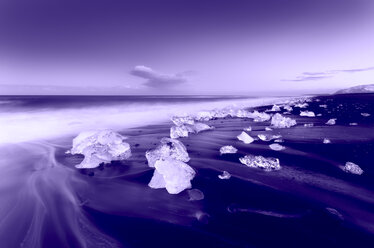 Iceland, Jokulsarlon, glacial ice on the beach in the evening - SMAF00982