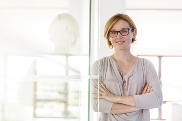 Portrait confident businesswoman in office - CAIF09919