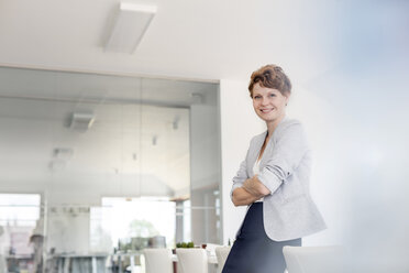 Portrait smiling businesswoman in conference room - CAIF09941