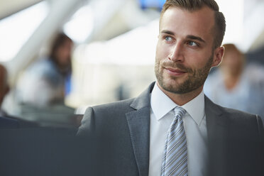 Pensive businessman looking away - CAIF10295