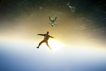 Aerial view of skydivers flying in air - CAVF05216