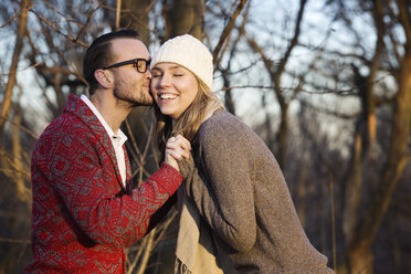 Romantic couple standing at park - CAVF05270