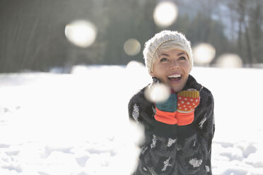 Woman laughing in snow - CAIF10994