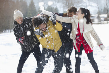 Friends enjoying snowball fight - CAIF11009