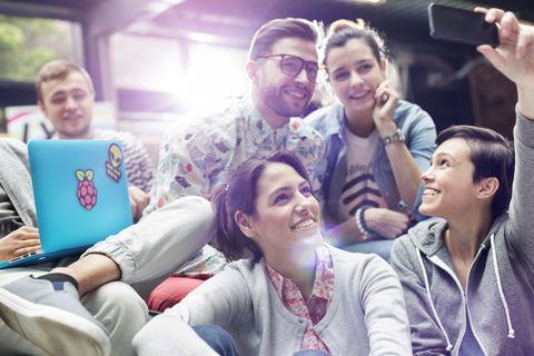 College students with laptop taking selfie with camera phone stock photo