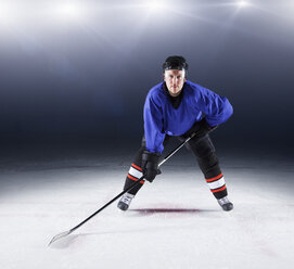 Portrait confident hockey player on ice - CAIF11143