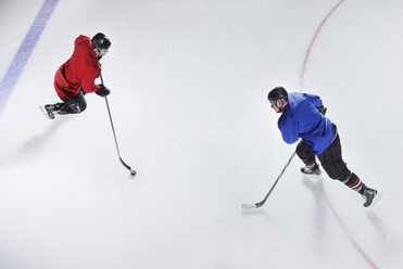 Overhead view hockey opponents with puck - CAIF11170