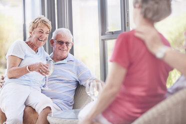 Senior couples drinking wine - CAIF11386