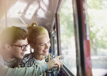 Couple drawing on bus window - CAIF11463