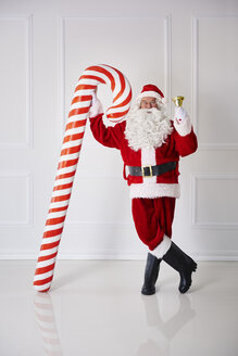 Santa Claus with handbell and candy cane - ABIF00125