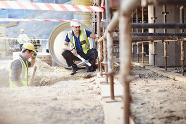 Construction workers working at construction site - CAIF11610