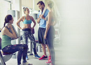 Friends talking and resting at gym - CAIF11818