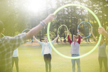 Group connected in circle by plastic hoops - CAIF11947