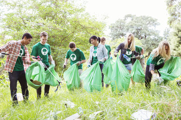 Environmentalist volunteers picking up trash - CAIF11995