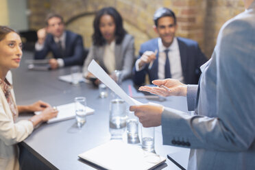 Businesswoman leading meeting in conference room - CAIF12064