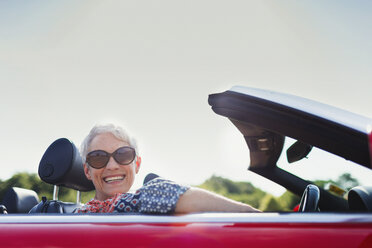 Portrait senior woman driving convertible - CAIF12224