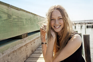 Portrait of smiling woman at pier - CAVF06022