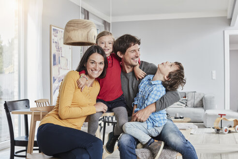 Portrait of happy family with two kids at home - RORF01185