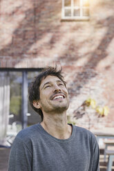 Portrait of happy man in front of his home - RORF01191