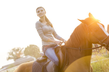 Woman horseback riding - CAIF12996