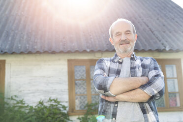 Portrait confident senior farmer outside farmhouse - CAIF13032