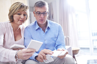 Couple browsing tile swatches - CAIF13233