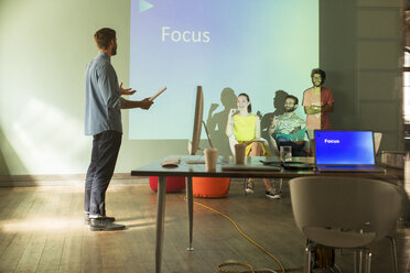 Business people preparing audio visual presentation on Focus - CAIF13835