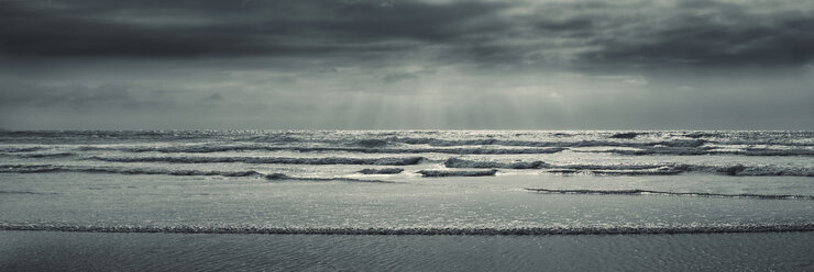 Booby's Bay, Scenic view of sea waves and beach in bay on cloudy day - CAIF14541