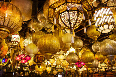Low angle view of various illuminated lamps in market - CAIF14547