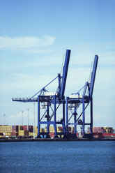 Cranes and cargo containers at waterfront - CAIF15095