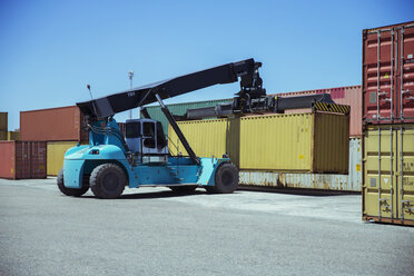 Crane lifting cargo container - CAIF15116